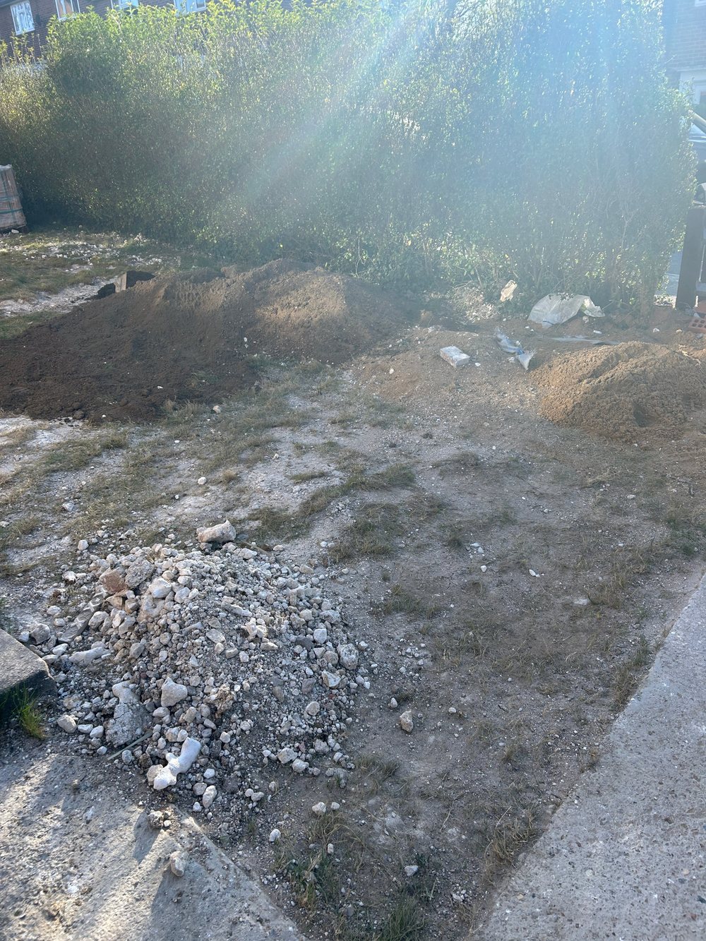 Before: bare ground, rubble and piles of soil in the front garden